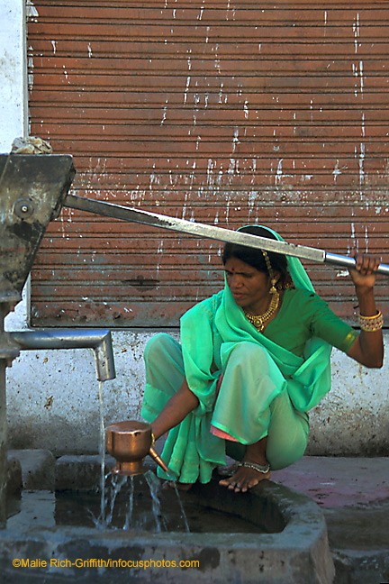 Hindu Woman Pumping Well Water Udaipur