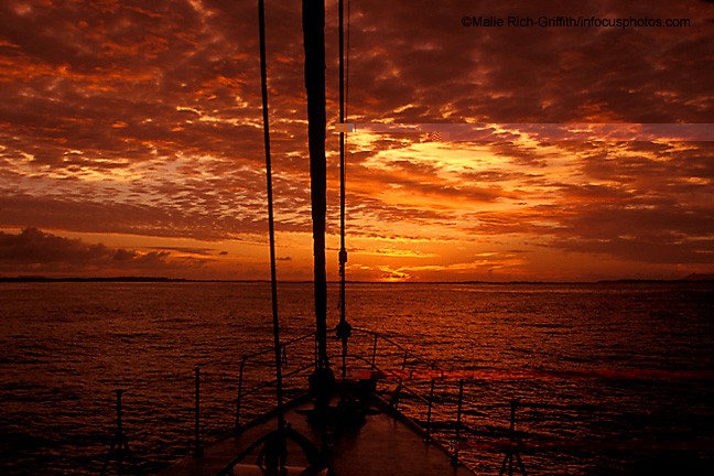 Sunset Pacific Ocean Galapagos Islands Sailboat Mast Clouds