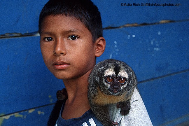 Boy and Pet Saki Monkey Iquitos Amazon