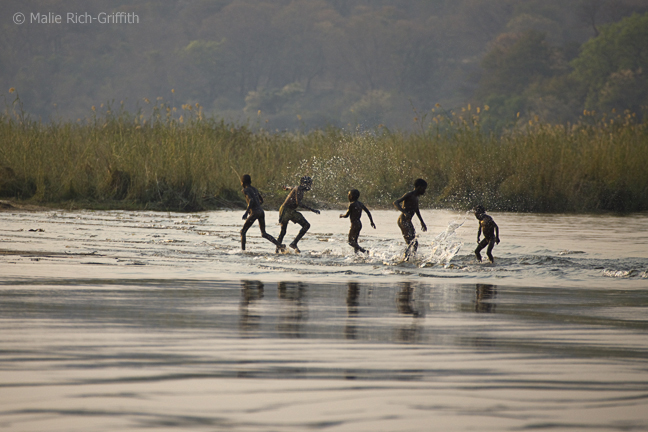 Infocusphotos : Boys Playing in the Kavango River, Ndohvu, Namibia